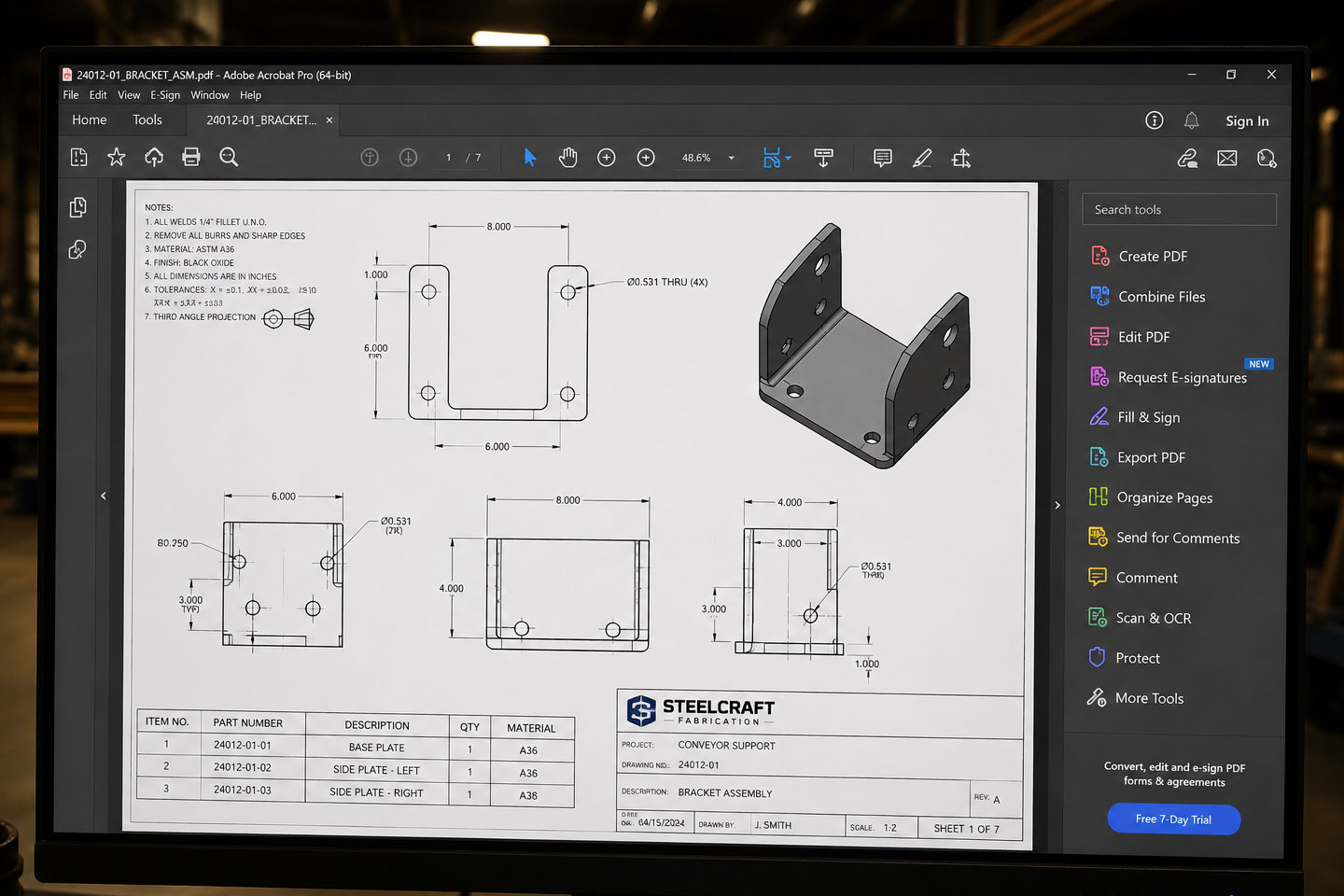 DCLA FAB fabrication PDF review package displayed on industrial engineering workstation with revision markups and technical annotations.